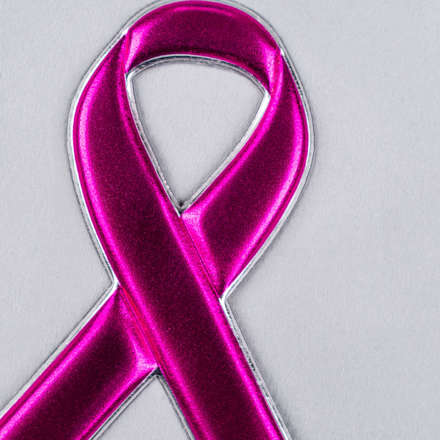FlexStyle Metallic Pink Ribbon emblem close up