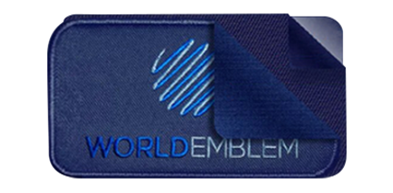World Emblem patch with the application layers pulled back to show the patch, glue blocker, and glue
